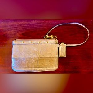 Coach Zip Wristlet With Metallic Gold Detail In Signature Canvas
